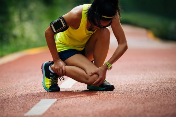 Woman Suffering Knee Injury While Running
